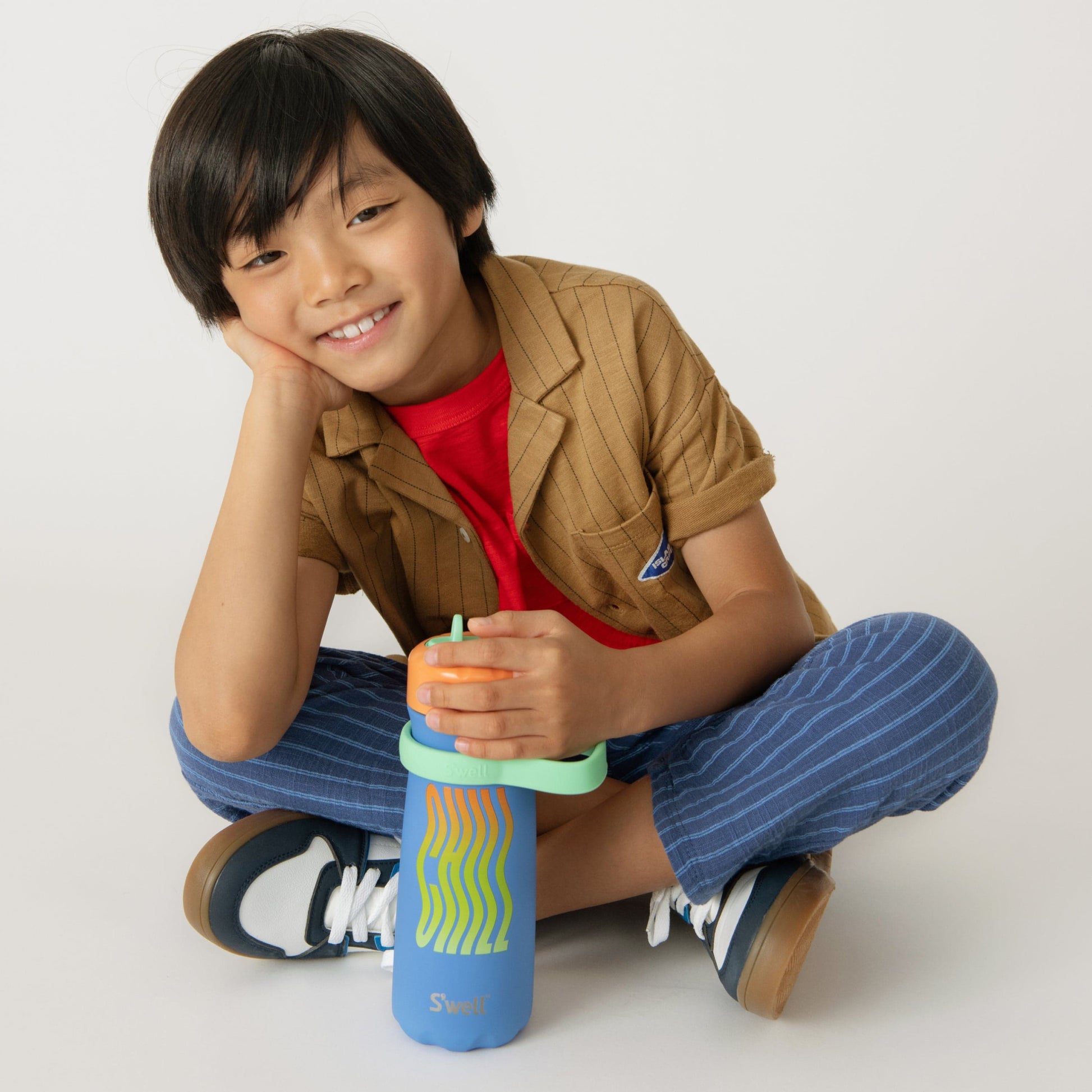 traveler-with-flip-straw-lid-16oz-f9 Swell-Kids-Water-Bottle-Traveler-16oz-Blue-Chill-Lifestyle.jpg